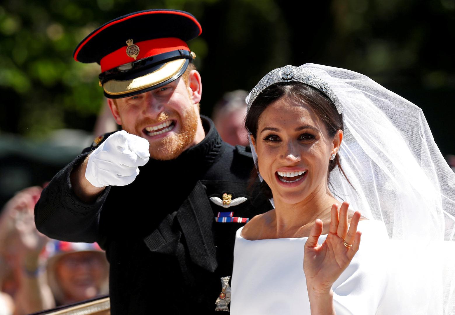 Britanski princ Harry i Meghan Markle u kočiji nakon vjenčanja u kapeli dvorca Windsor 19. svibnja 2018.