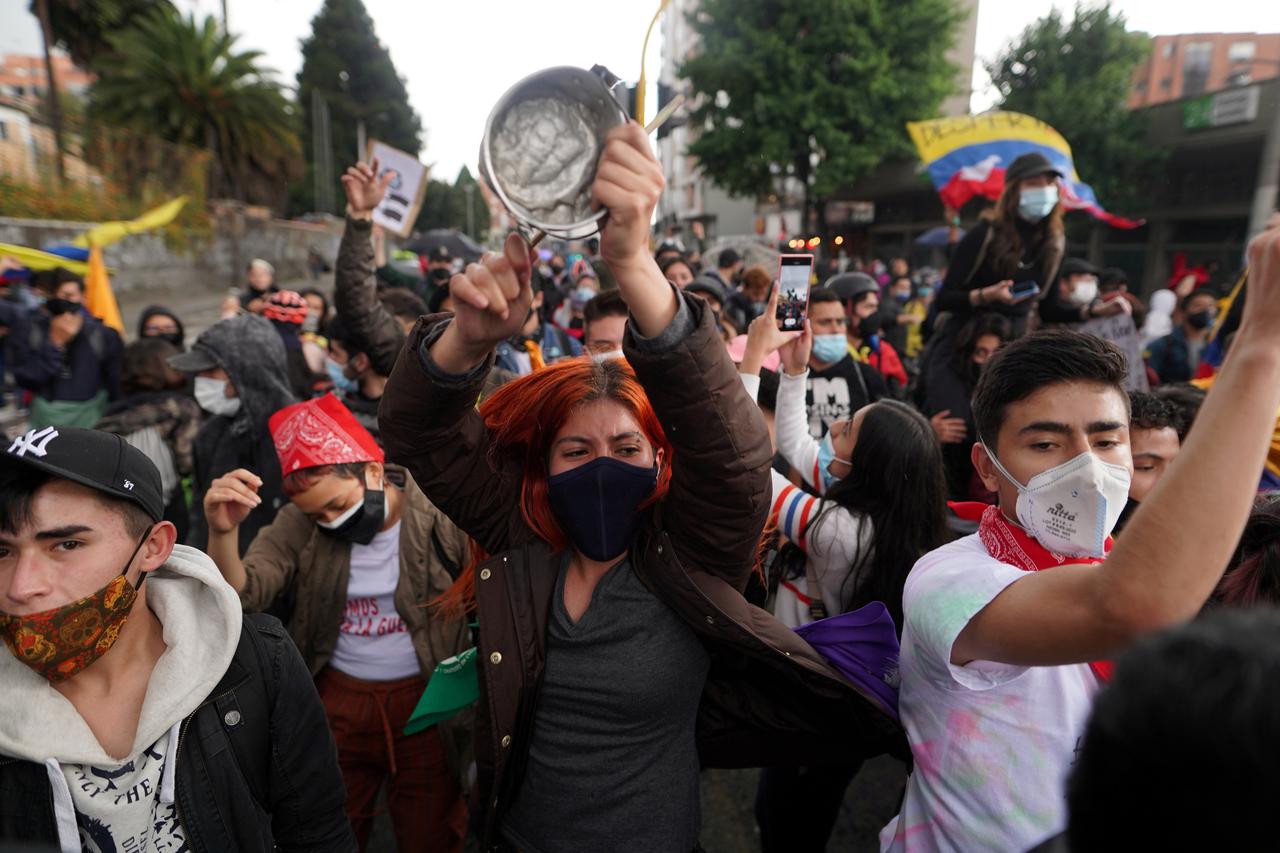Demonstrators take to the streets to protest against poverty and police violence, in Bogota