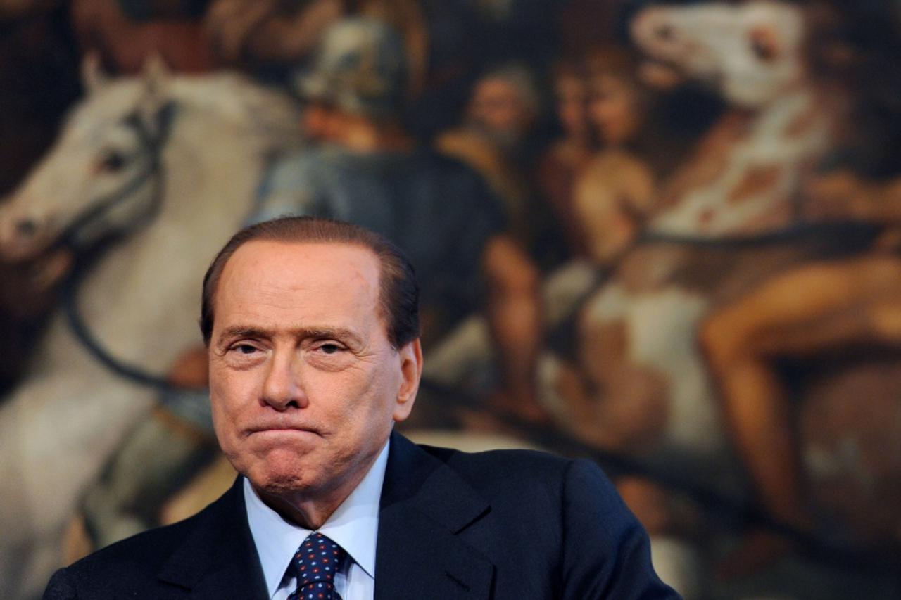 \'epa03000950 (FILE) Photo dated 21 May 2010 shows Italian Prime Minister Silvio Berlusconi during a press conference with his Bulgarian counterpart Bojko Borisov (unseen) in Rome\' Chigi Palace. Ital