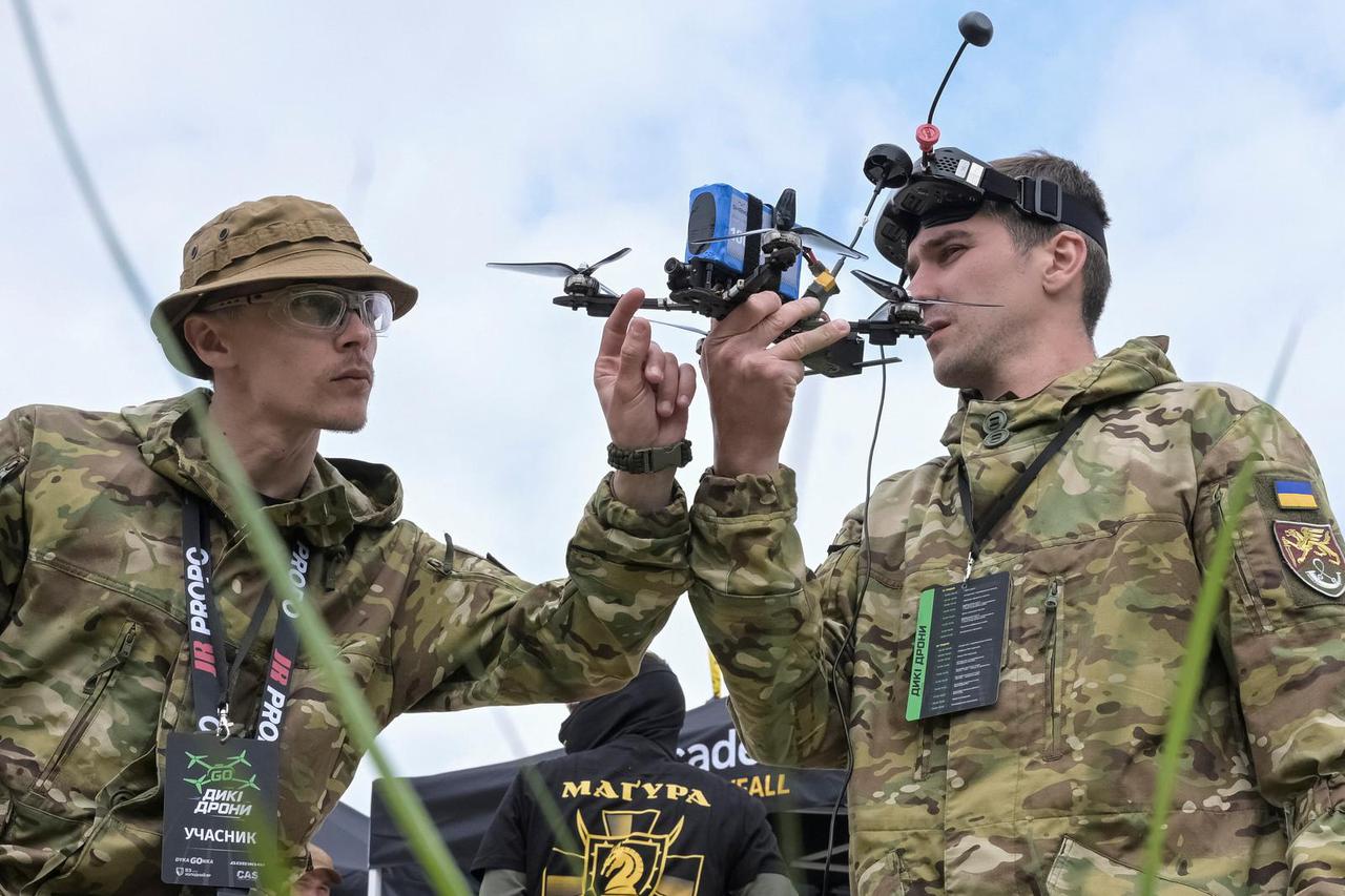 Participant of drones competition check an FPV drone before a race in Lviv region