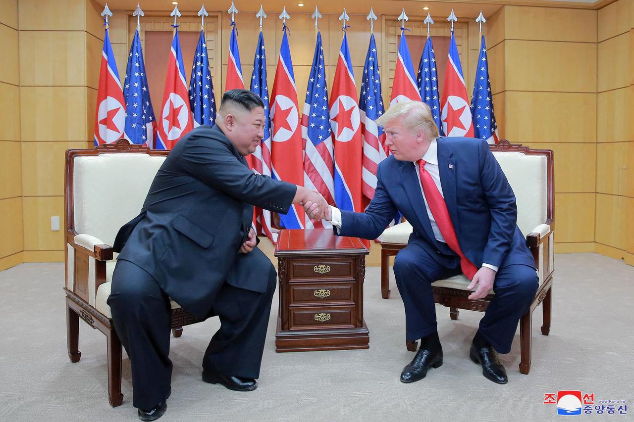 FILE PHOTO: Trump meets with North Korean leader Kim Jong Un at DMZ on border of North and South Korea