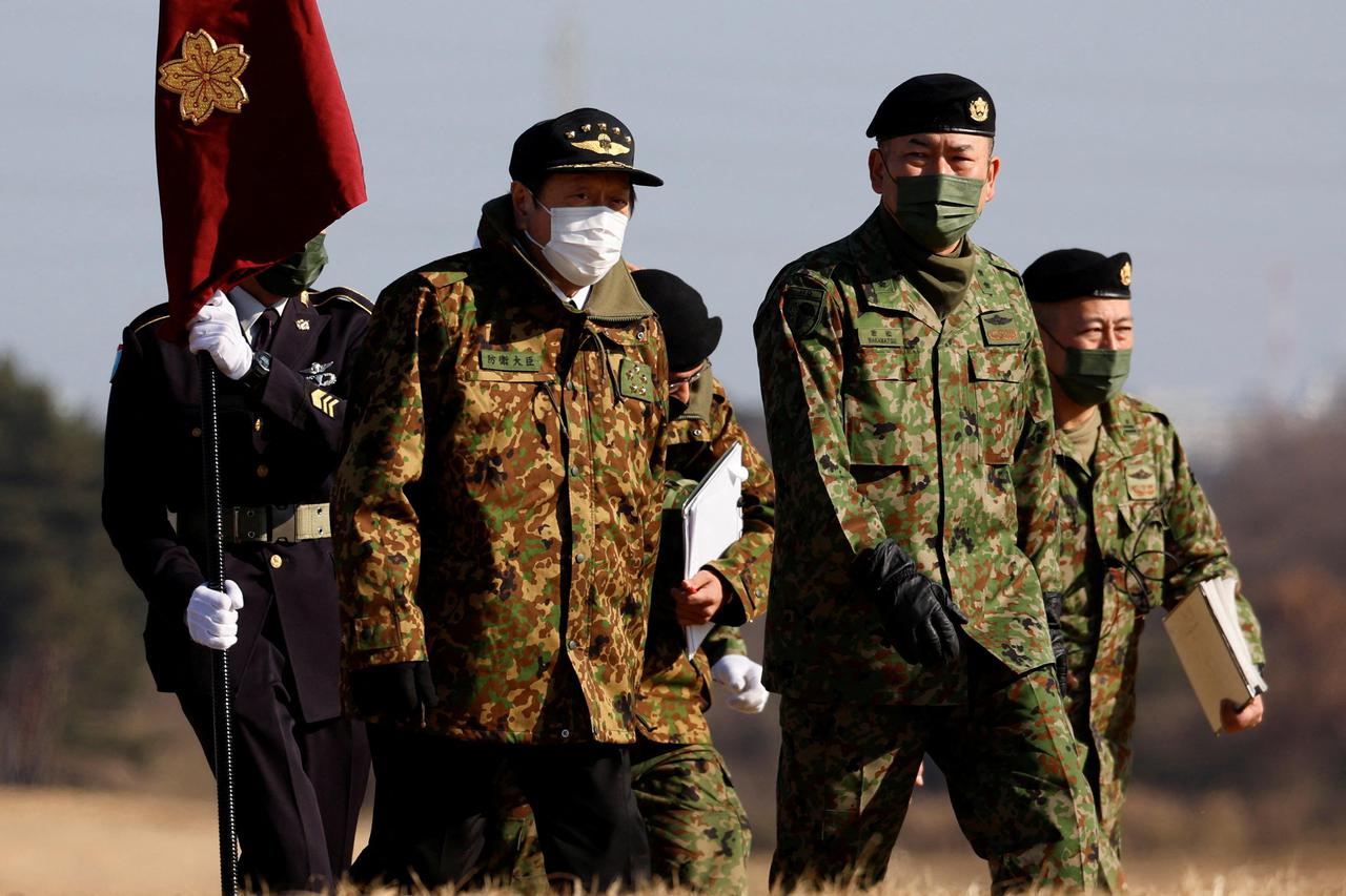 Japan's Defence Minister Yasukazu Hamada inspects a New Year joint military drill among Japan, U.S., Britain and Australia at Narashino exercise field in Funabashi