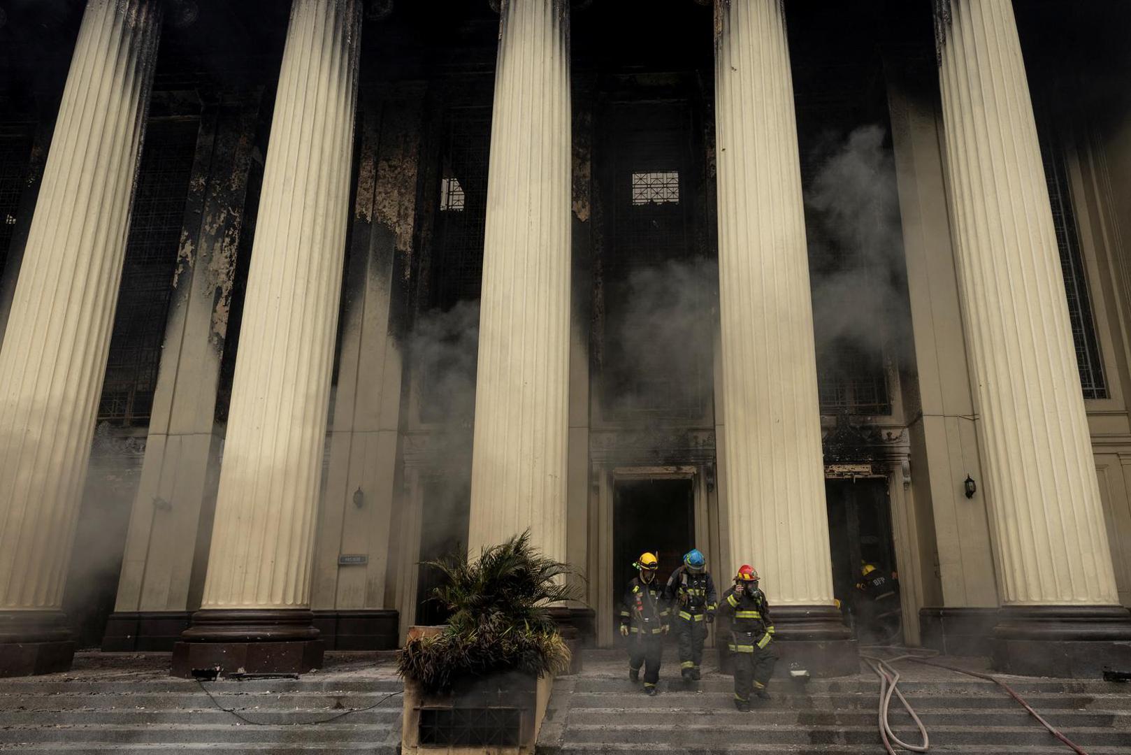 Firefighters walk out of the burning Manila Central Post Office building after a massive fire, in Manila, Philippines, May 22, 2023. REUTERS/Eloisa Lopez Photo: ELOISA LOPEZ/REUTERS
