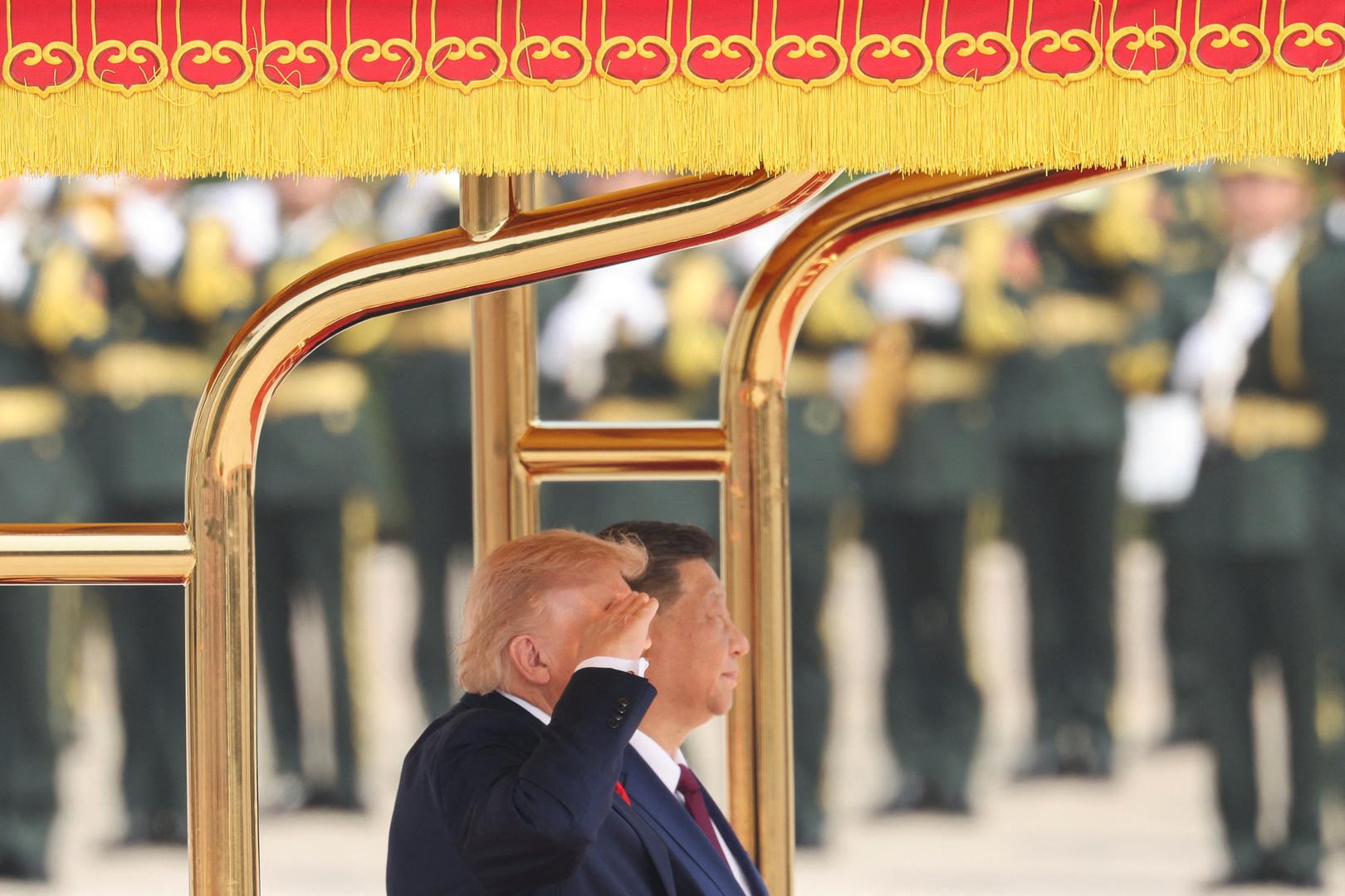 U.S. President Donald Trump salutes next to Chinese President Xi Jinping during a welcome ceremony at the Great Hall of the People, in Beijing, China, May 14, 2026. REUTERS/Maxim Shemetov/Pool Photo: MAXIM SHEMETOV/REUTERS