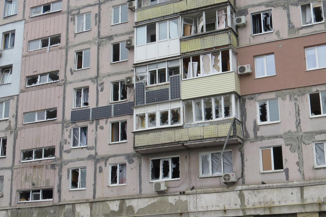 A view shows a damaged residential building in Mariupol