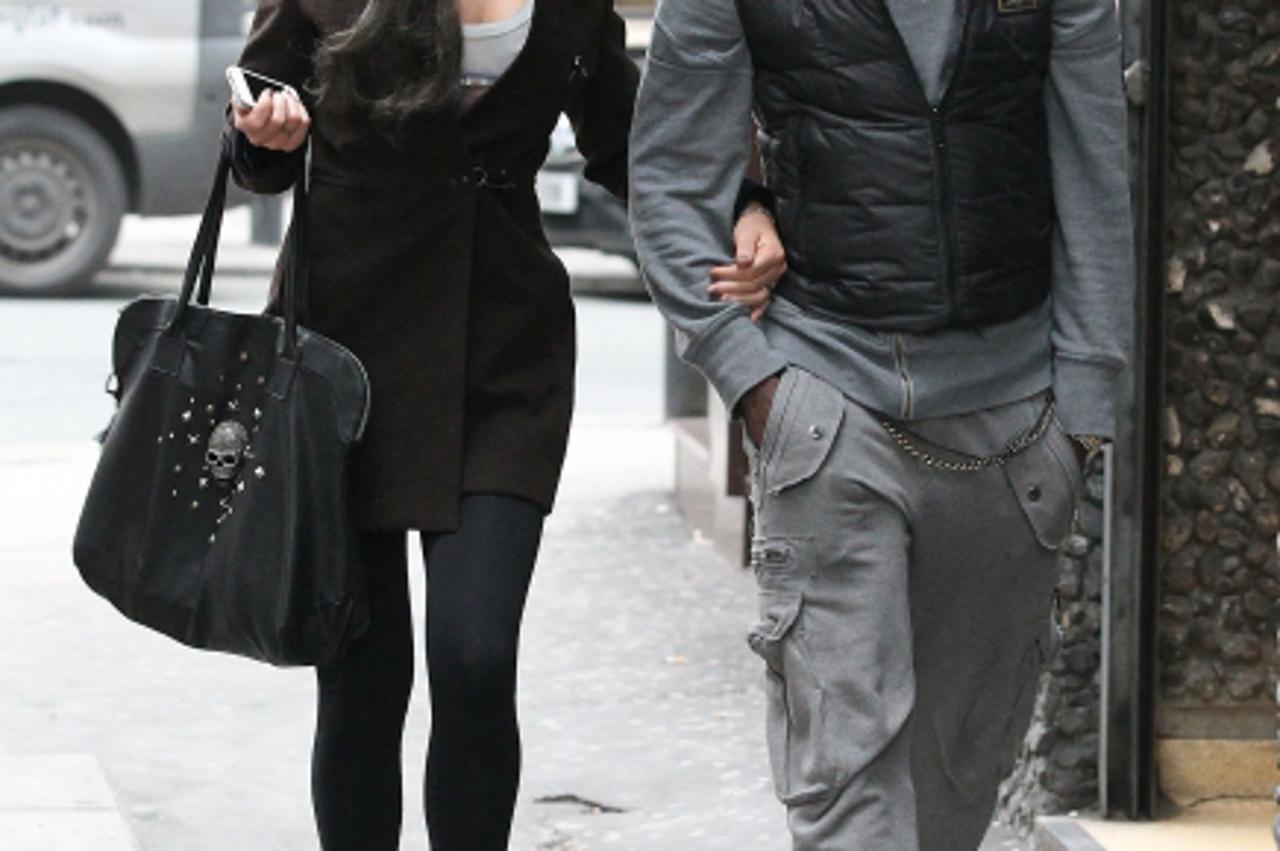 'Image: 0116213860, License: Rights managed, Restrictions: NO UK SALES, Mario Balotelli and Rafaella Fico leaving San Carlo Italian restaurant in Manchester, Place: England, Model Release: No or not a