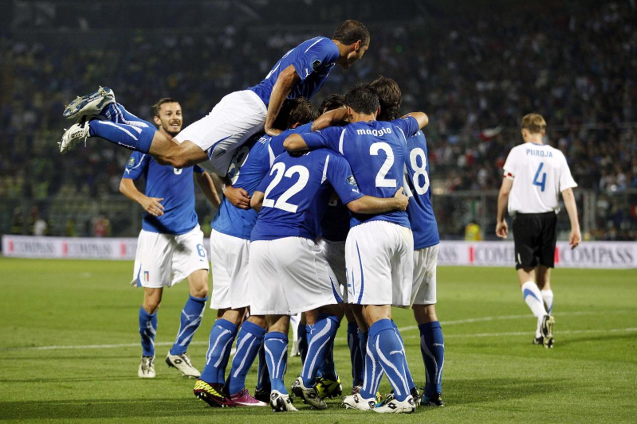 \'Italy\'s Antonio Cassano (obscured) celebrates with teammates after scoring against Estonia during their Euro 2012 Group C qualifying soccer match at the Braglia stadium in Modena June 3, 2011. REUT