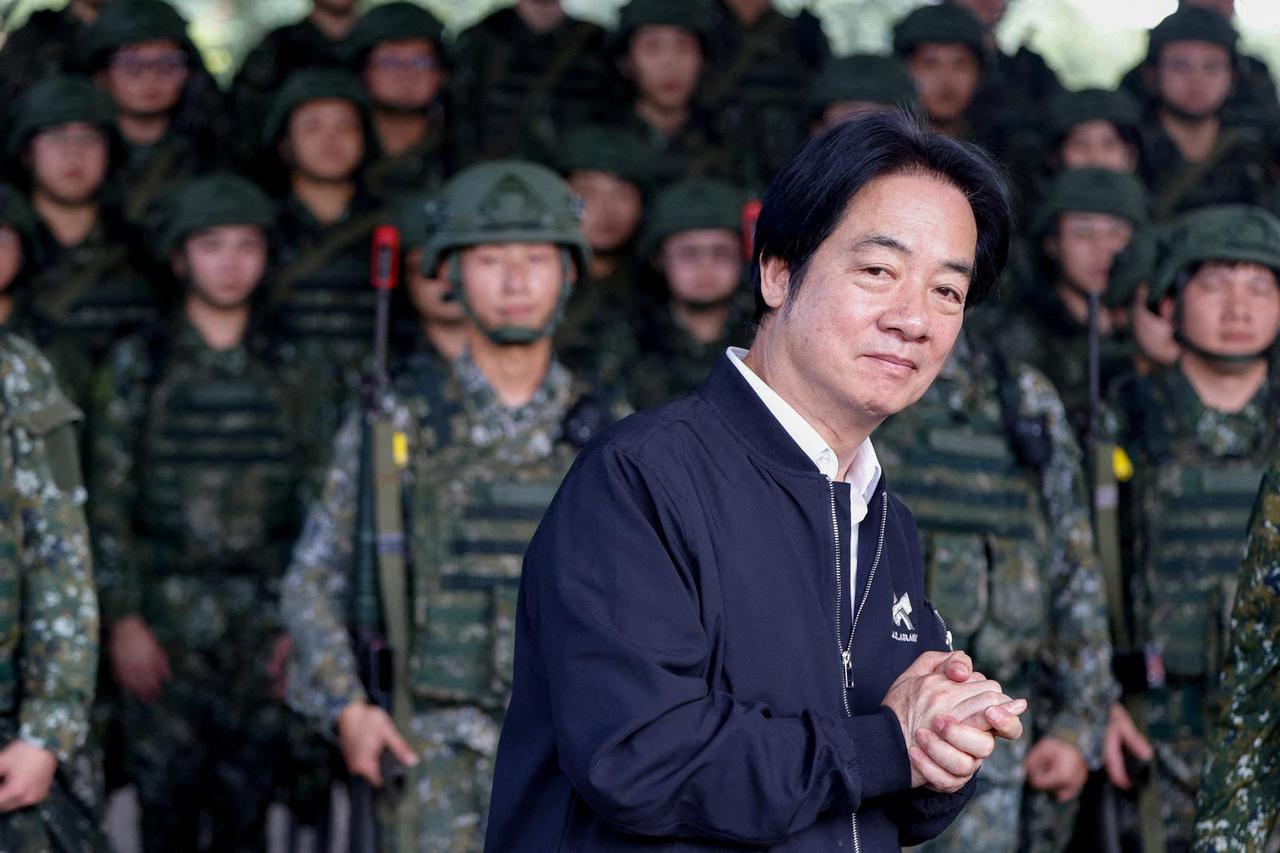 FILE PHOTO: Taiwan President Lai Ching-te inspects reservists during a training session at Loung Te Industrial Parks Service Center in Yilan