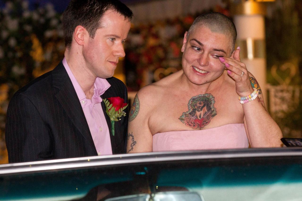 'Image: 0108913533, License: Rights managed, Sinead O\'Conner marries Barry Herridge on her 45th Birthday at \'A Little White Wedding Chapel\' drive-thru in Las Vegas, NV on December 8, 2011. Â© RD / 