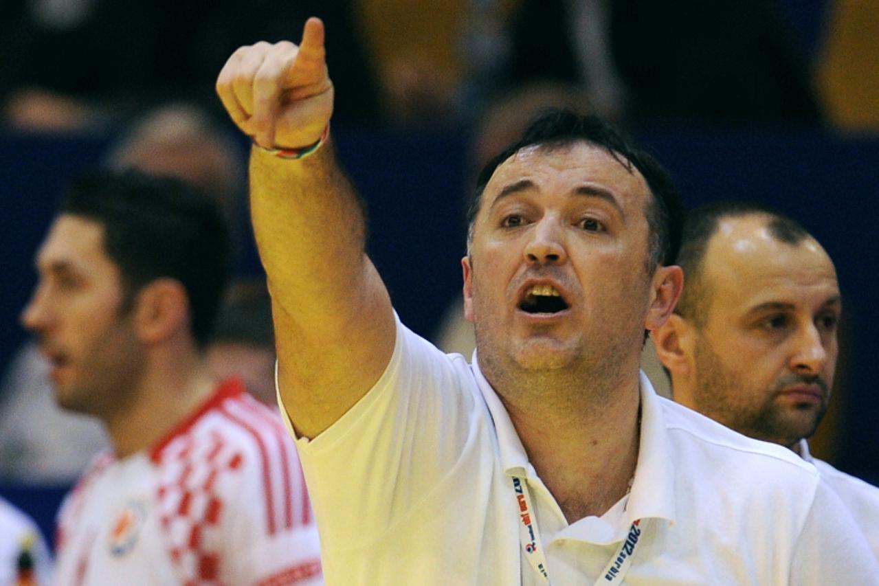 'Croatia\'s head coach Slavko Goluza reacts during the men\'s EHF Euro 2012 Handball Championship match between Spain and Croatia at the sports hall in Novi Sad on January 22, 2012. AFP PHOTO / FRANCK