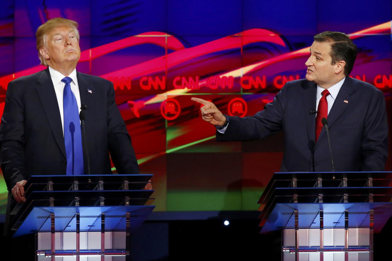 Republican U.S. presidential candidate Ted Cruz challenges rival Donald Trump (L) about releasing his tax returns during the debate sponsored by CNN for the 2016 Republican U.S. presidential candidates in Houston, Texas, February 25, 2016. REUTERS/Mike St