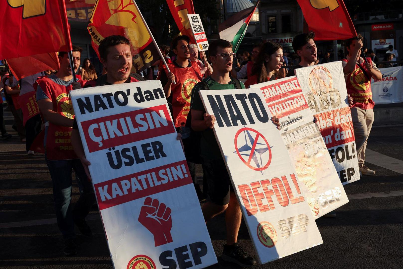 Demonstrators hold signs and flags during a protest ahead of NATO leaders' summit, in Istanbul, Turkey, July 5, 2026. REUTERS/Dilara Senkaya Photo: DILARA SENKAYA/REUTERS