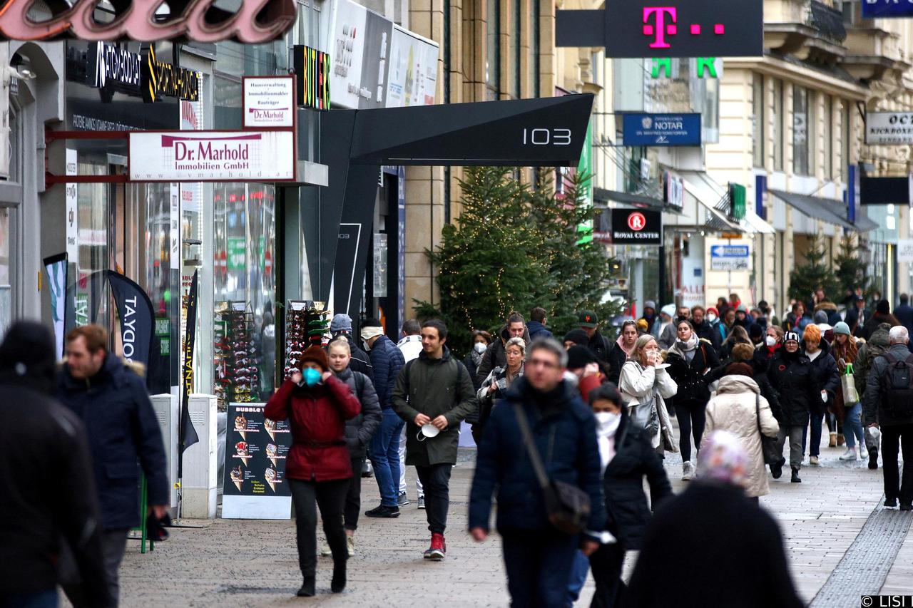 FILE PHOTO: People walk along a shopping street after the fourth full national coronavirus disease (COVID-19) lockdown was lifted, in Vienna, Austria, December 13