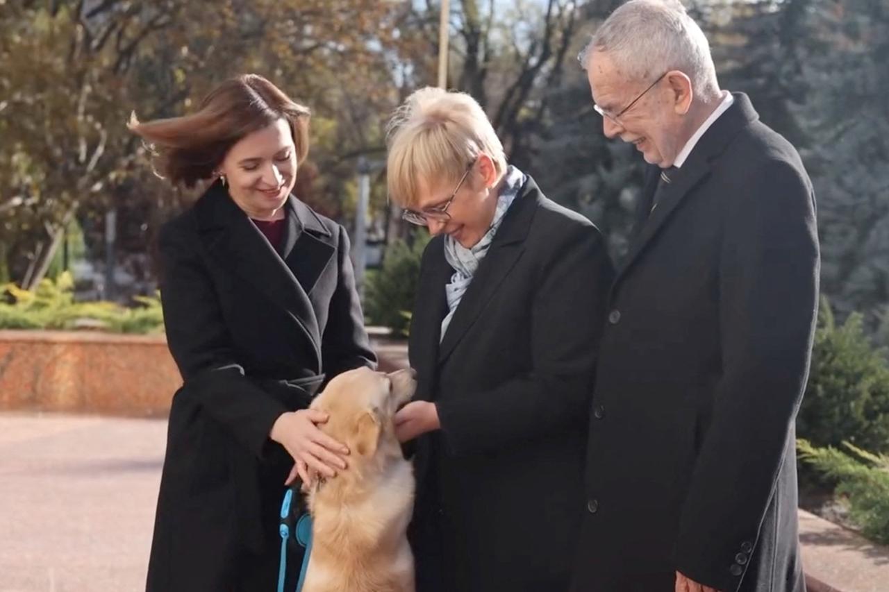 Moldova's President Sandu and her dog greet Austria's President Van der Bellen and Slovenia's President Pirc Musar in Chisinau