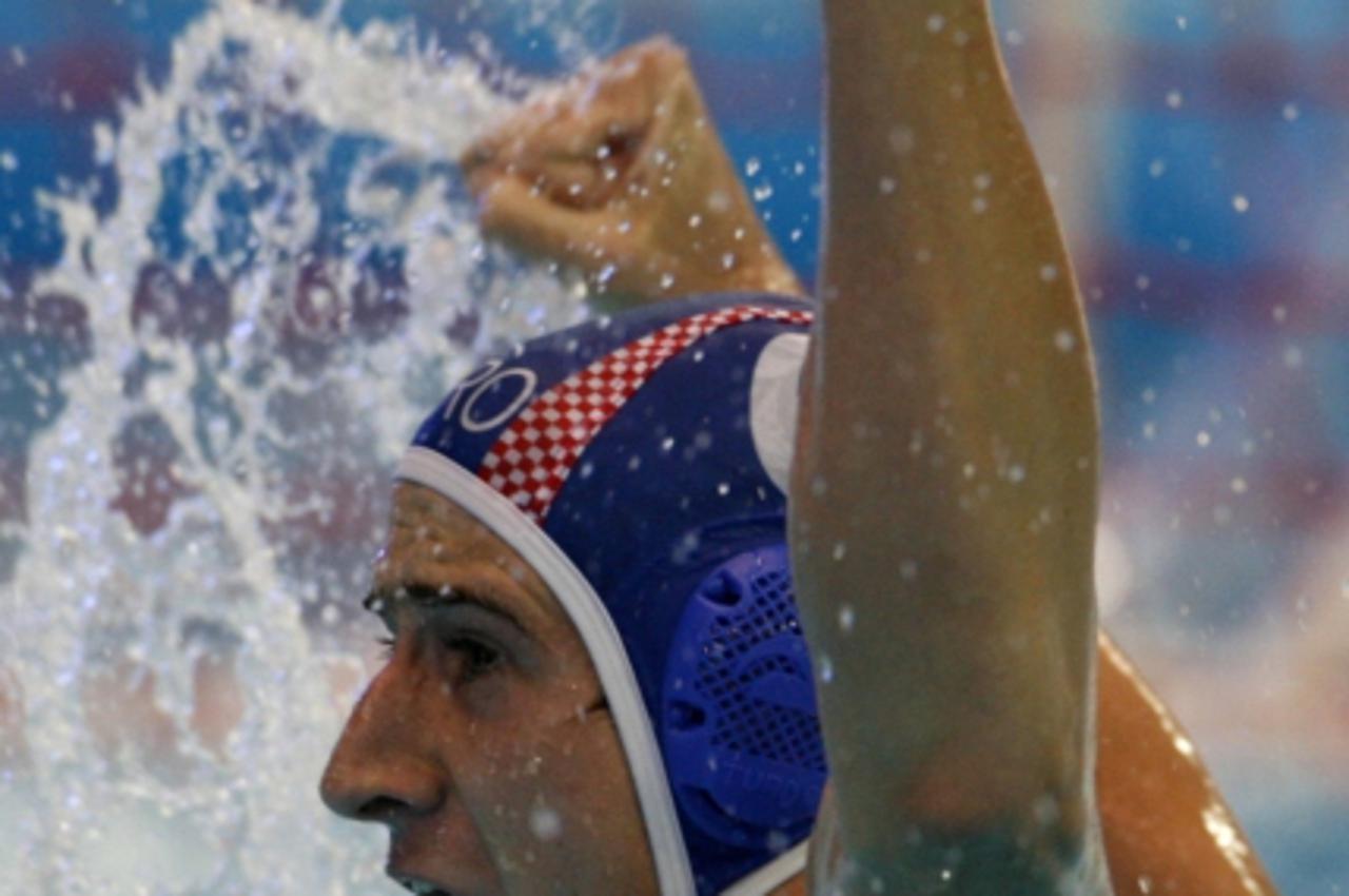 'Maro Jokovic of Croatia reacts after scoring a goal during their water polo semi-final match against Serbia at the World Aquatics Championships in Melbourne March 30, 2007.    REUTERS/Laszlo Balogh (