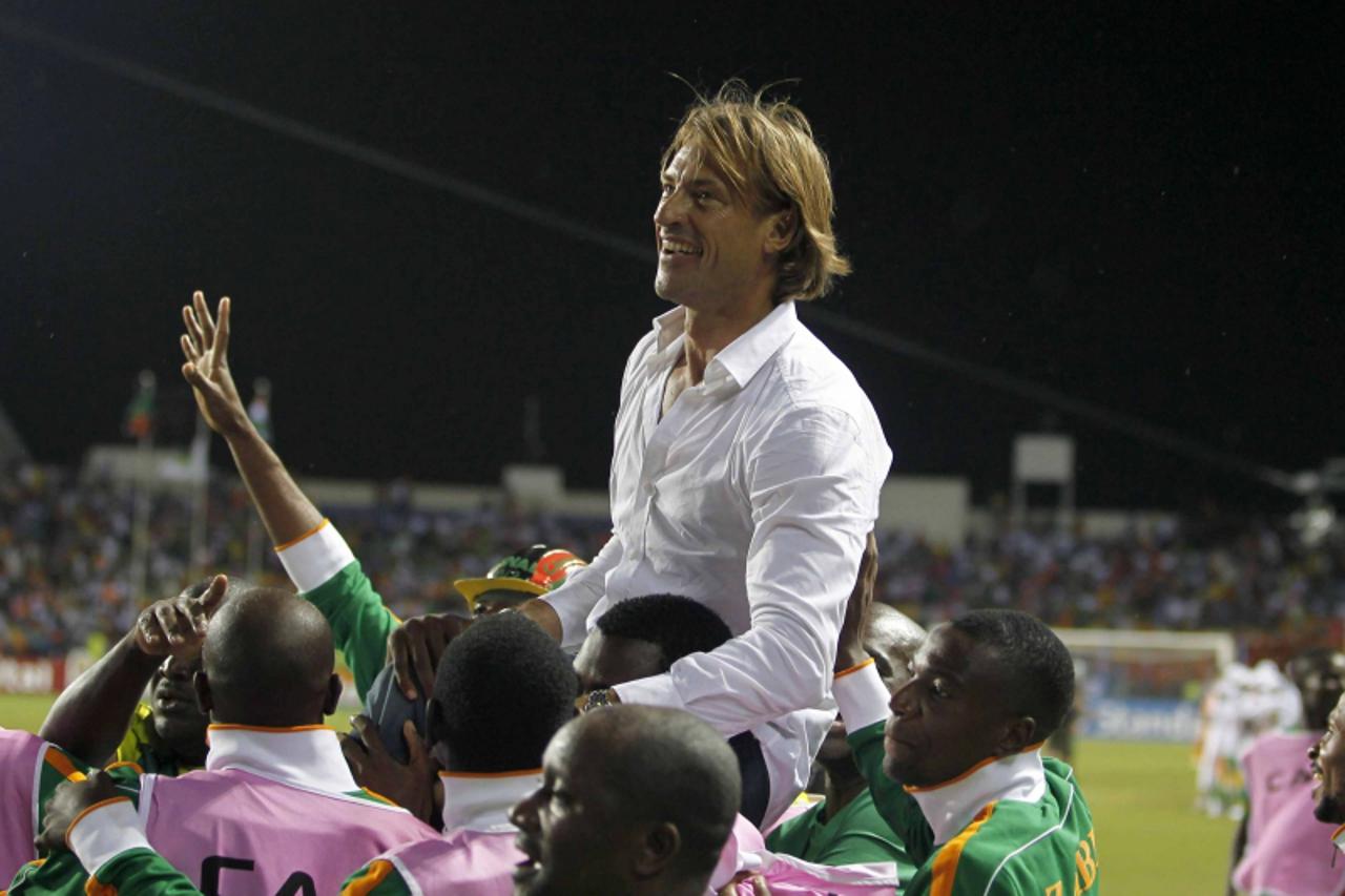 'Zambia\'s head coach Herve Renard celebrates with his team after their victory against Ivory Coast in their African Nations Cup final soccer match at the Stade De L\'Amitie Stadium in Libreville Febr