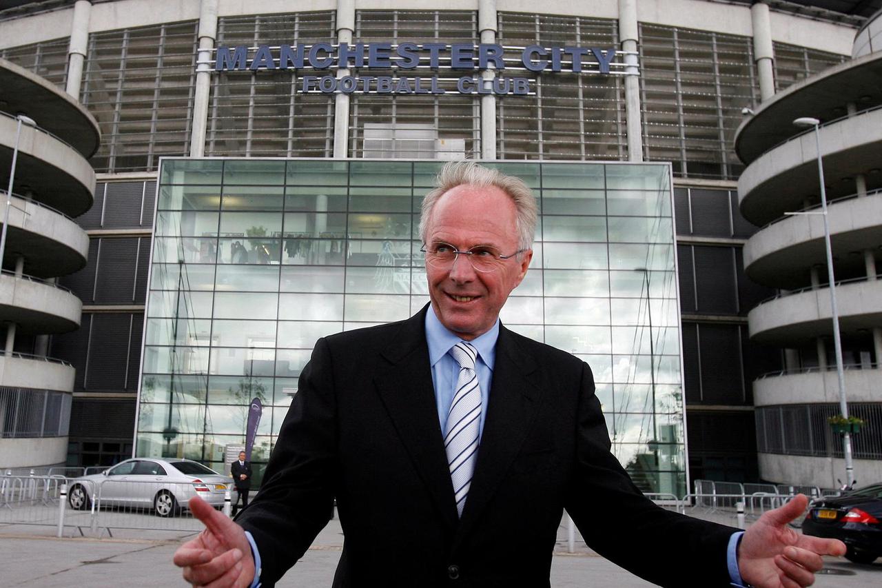 FILE PHOTO: Manchester City's new manager Eriksson poses for photographers outside the City of Manchester stadium in Manchester