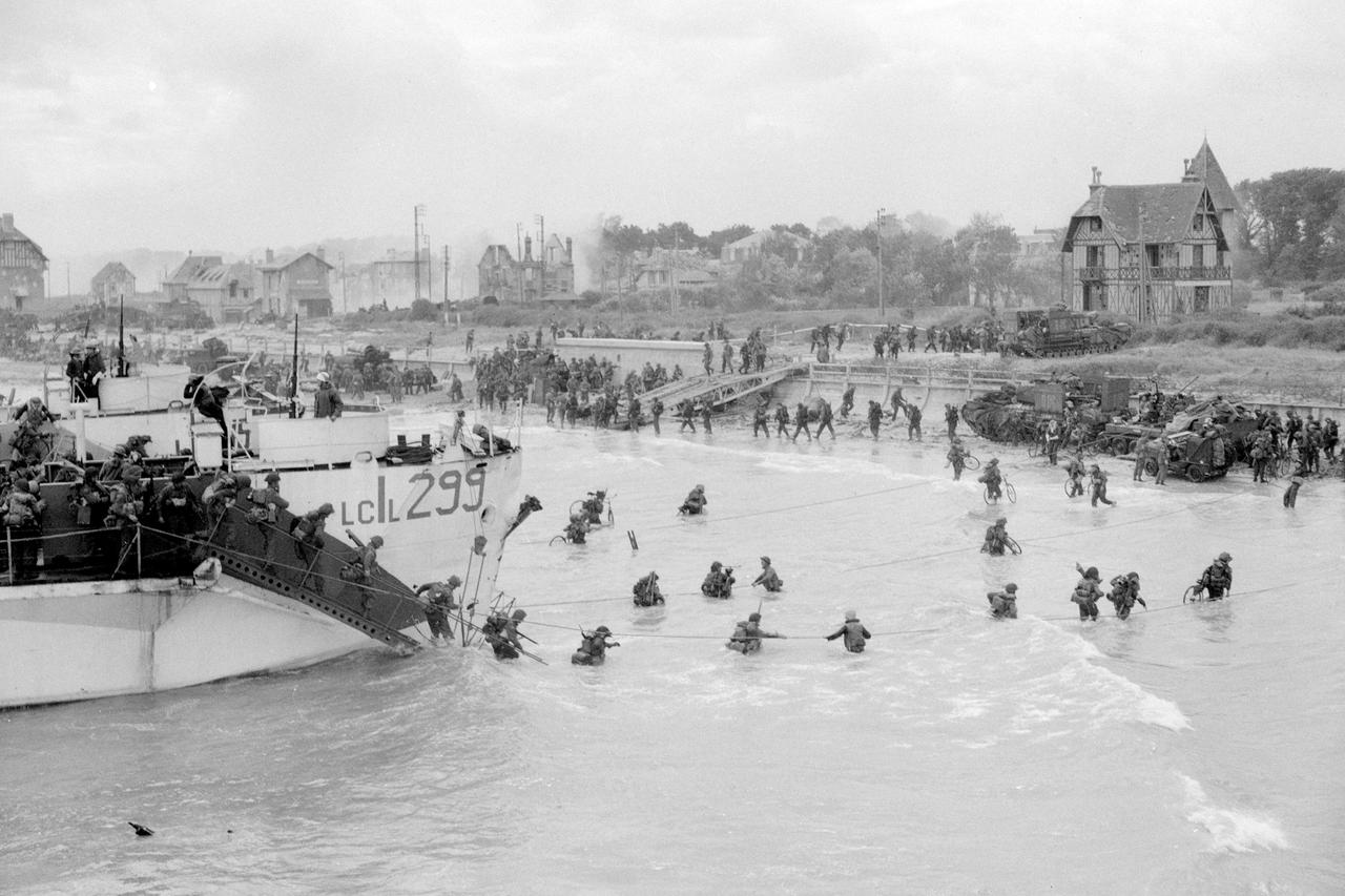 Canadian troops come ashore at a Juno Beach landing area on D-Day at Bernieres Sur Mer,