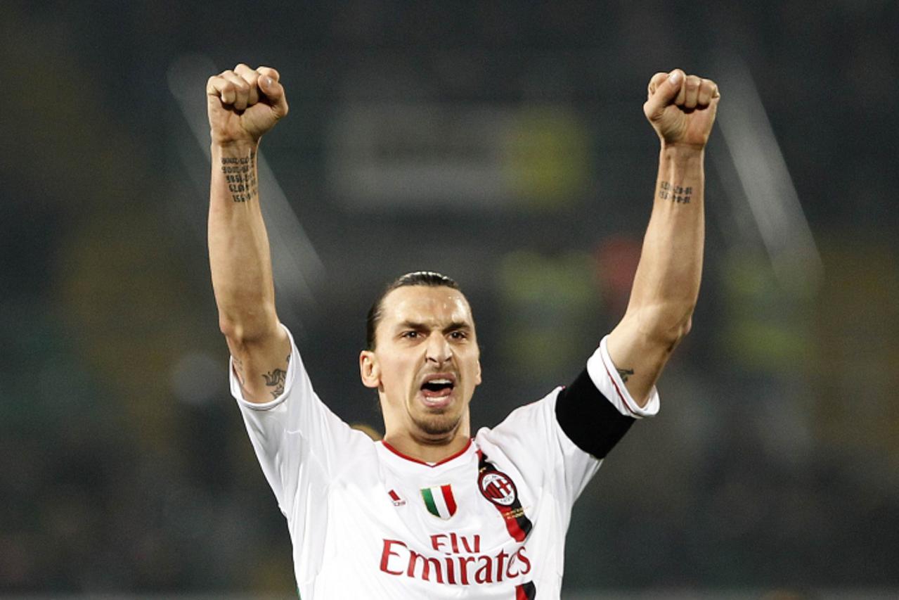 'AC Milan\'s Zlatan Ibrahimovic celebrates after scoring against Palermo during their Italian Serie A soccer match at the Renzo Barbera stadium in Palermo March 3, 2012.  REUTERS/Tony Gentile  (ITALY 