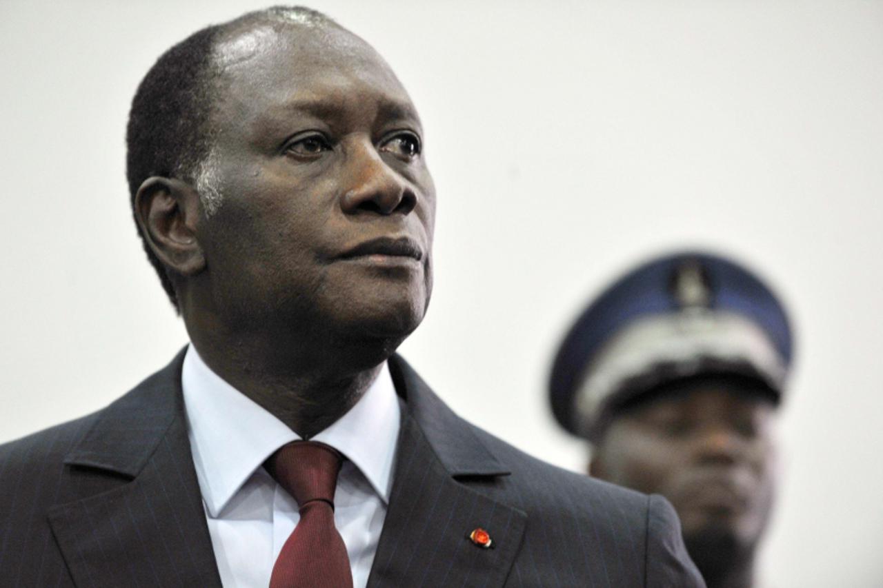\'This picture taken on December 4, 2010 shows Ivory Coast presidential candidate Alassane Dramane Ouattara attending a ceremony in a hotel in Abidjan after Prime Minister Guillaume Soro, leader of th
