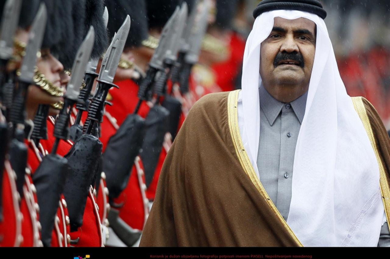 'The Emir of Qatar Sheik Hamad bin Khalifa Al-Thani, inspects the guard of honour in the grounds at Windsor Castle Photo: Press Association/Pixsell'