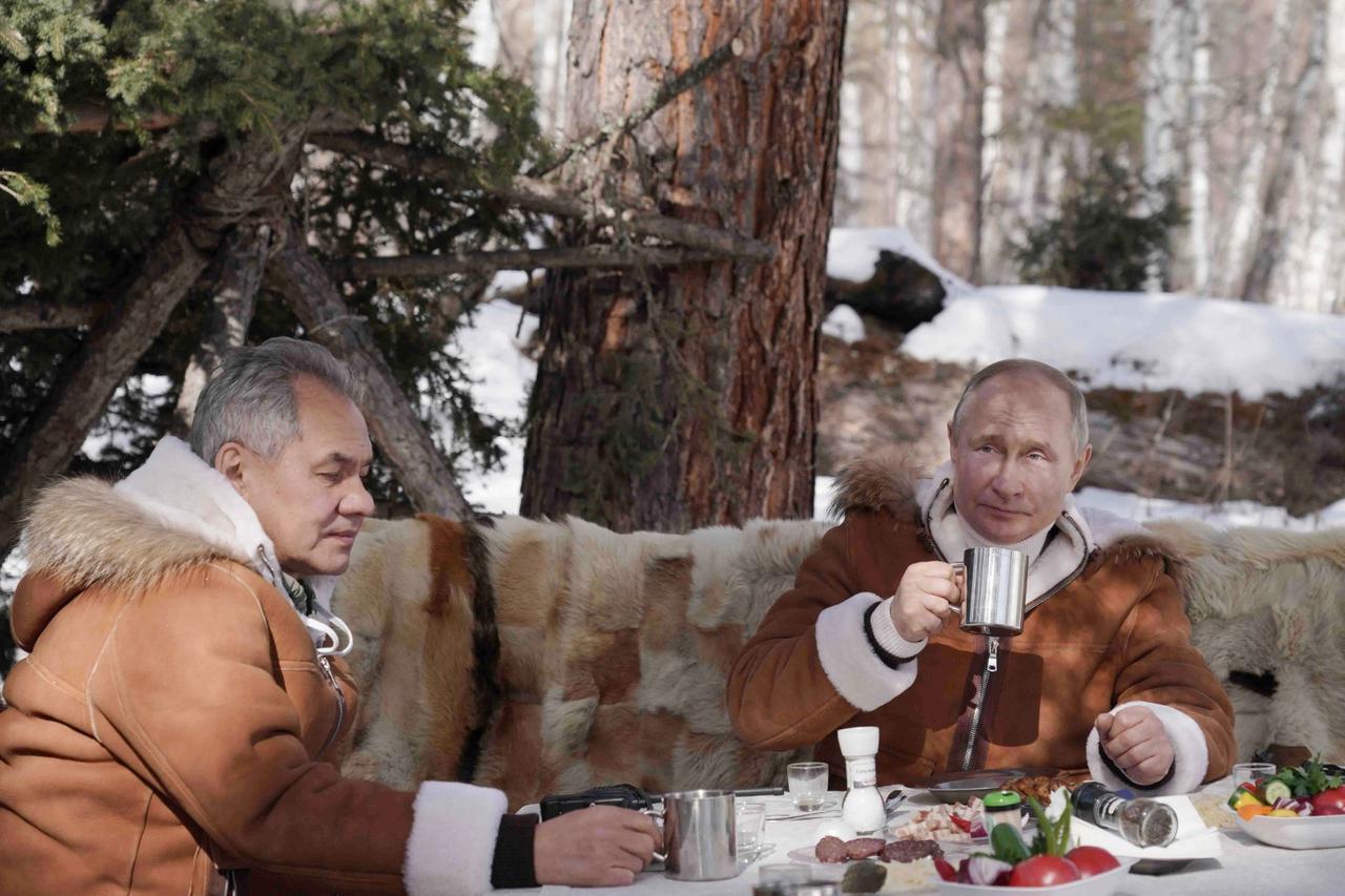 Russian President Putin and Defense Minister Shoigu take break in Siberia
