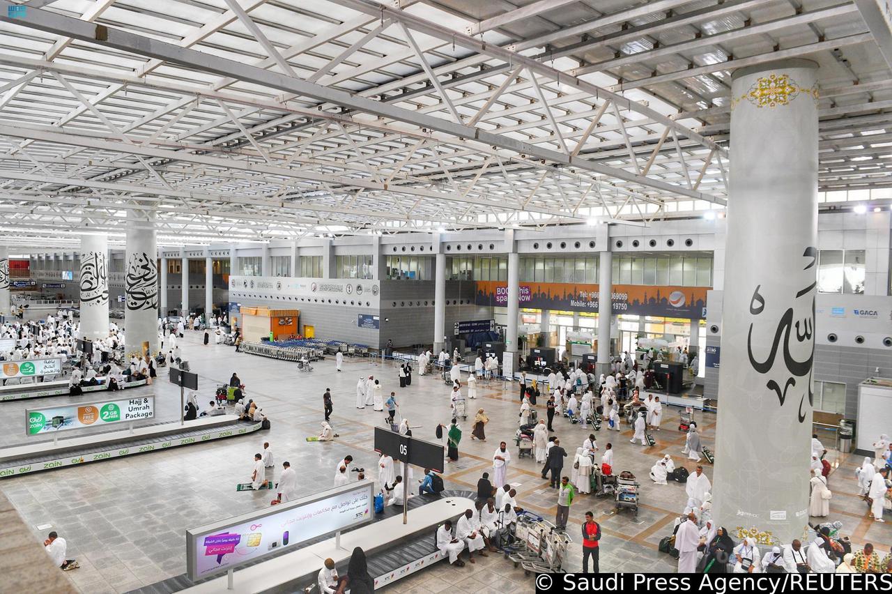 Muslims are seen at baggage hall upon their arrival for the annual Haj pilgrimage at King Abdulaziz International Airport, Jeddah, Saudi Arabia