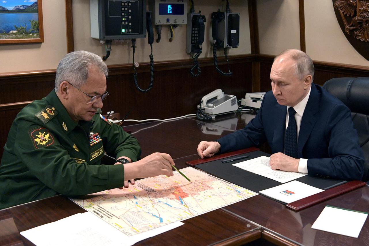 FILE PHOTO: Russia's President Putin and Defence Minister Shoigu meet in St Petersburg