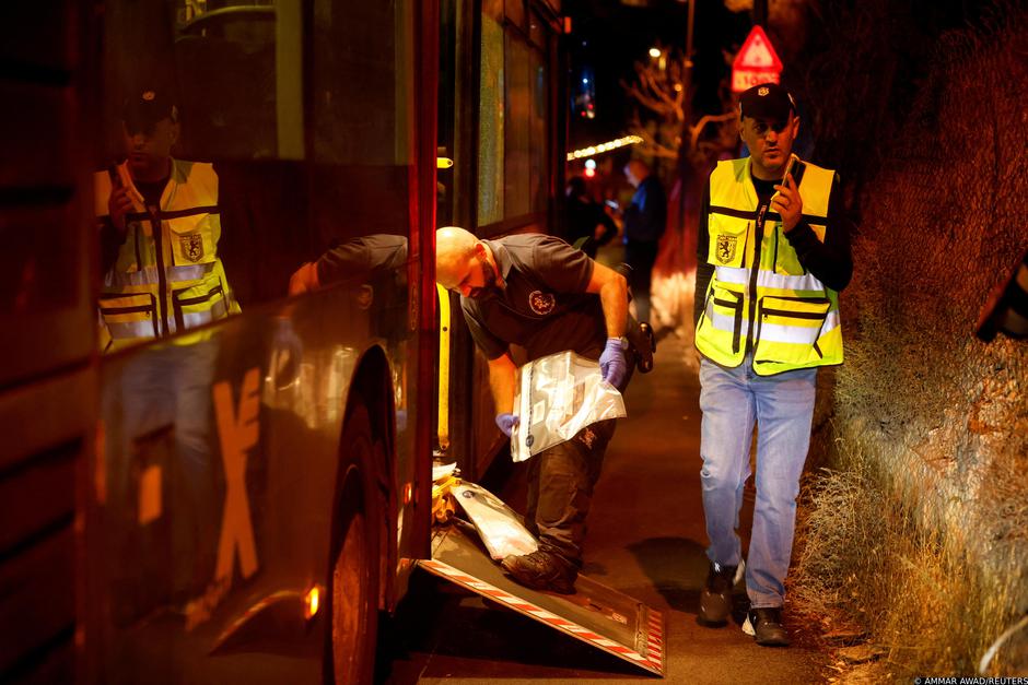 Israeli security personnel check a bus following an incident in Jerusalem