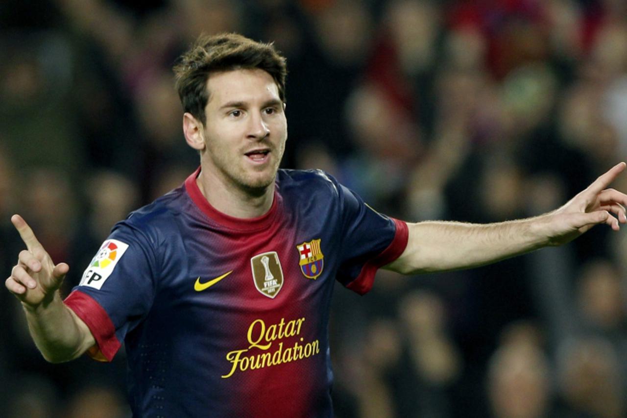 'Barcelona's Lionel Messi celebrates a goal against Zaragoza during their Spanish First division soccer league match at Camp Nou stadium in Barcelona, November 17, 2012. REUTERS/Albert Gea (SPAIN - T