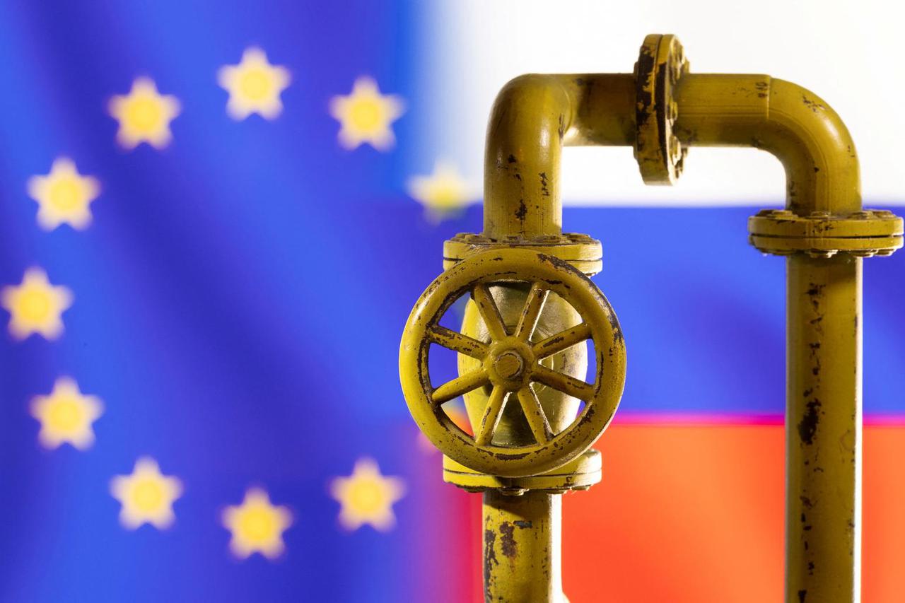 FILE PHOTO: Illustration shows natural gas pipeline in front of word EU and Russia flag colours