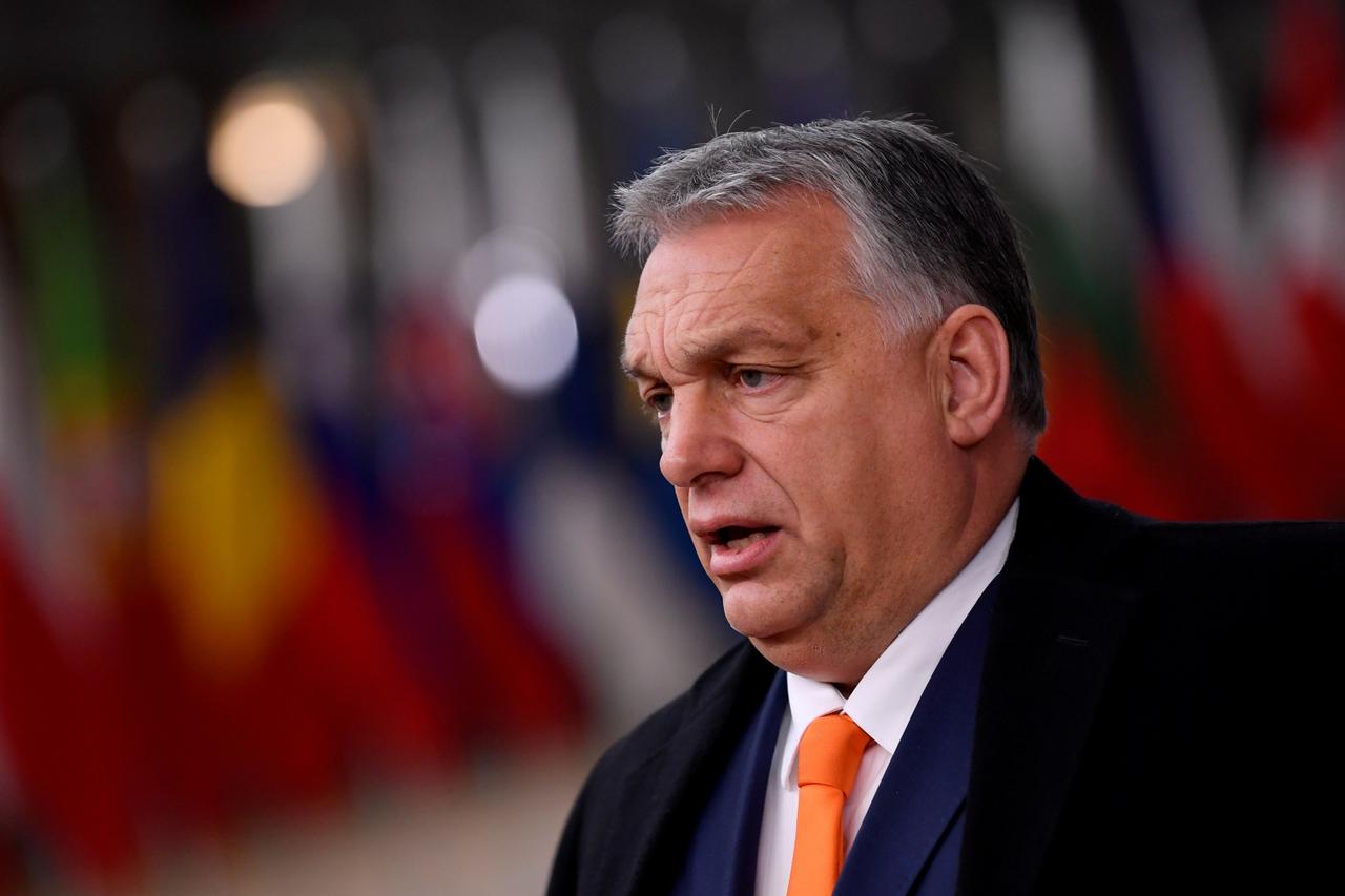FILE PHOTO: Hungary's Prime Minister Viktor Orban speaks on arrival for an EU summit in Brussels