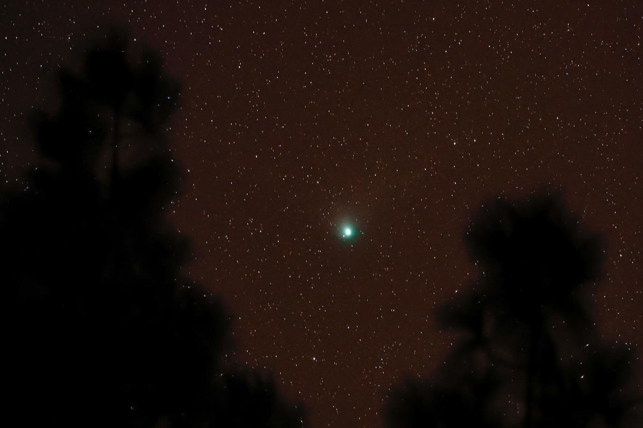 A green comet named Comet C/2022 E3 (ZTF), which last passed by our planet about 50,000 years ago is seen from the Pico de las Nieves