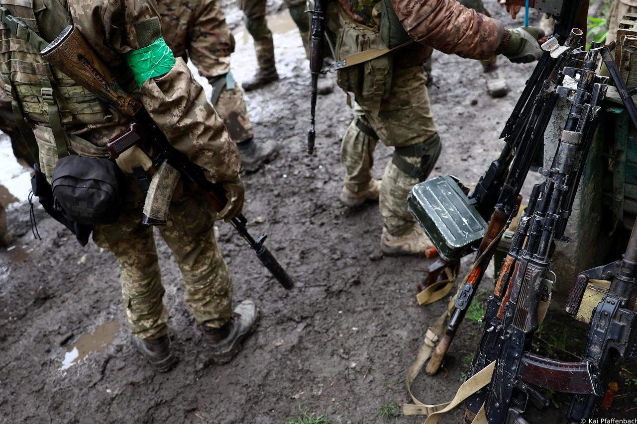 Ukrainian servicemen return from heavy fighting near Bakhmut