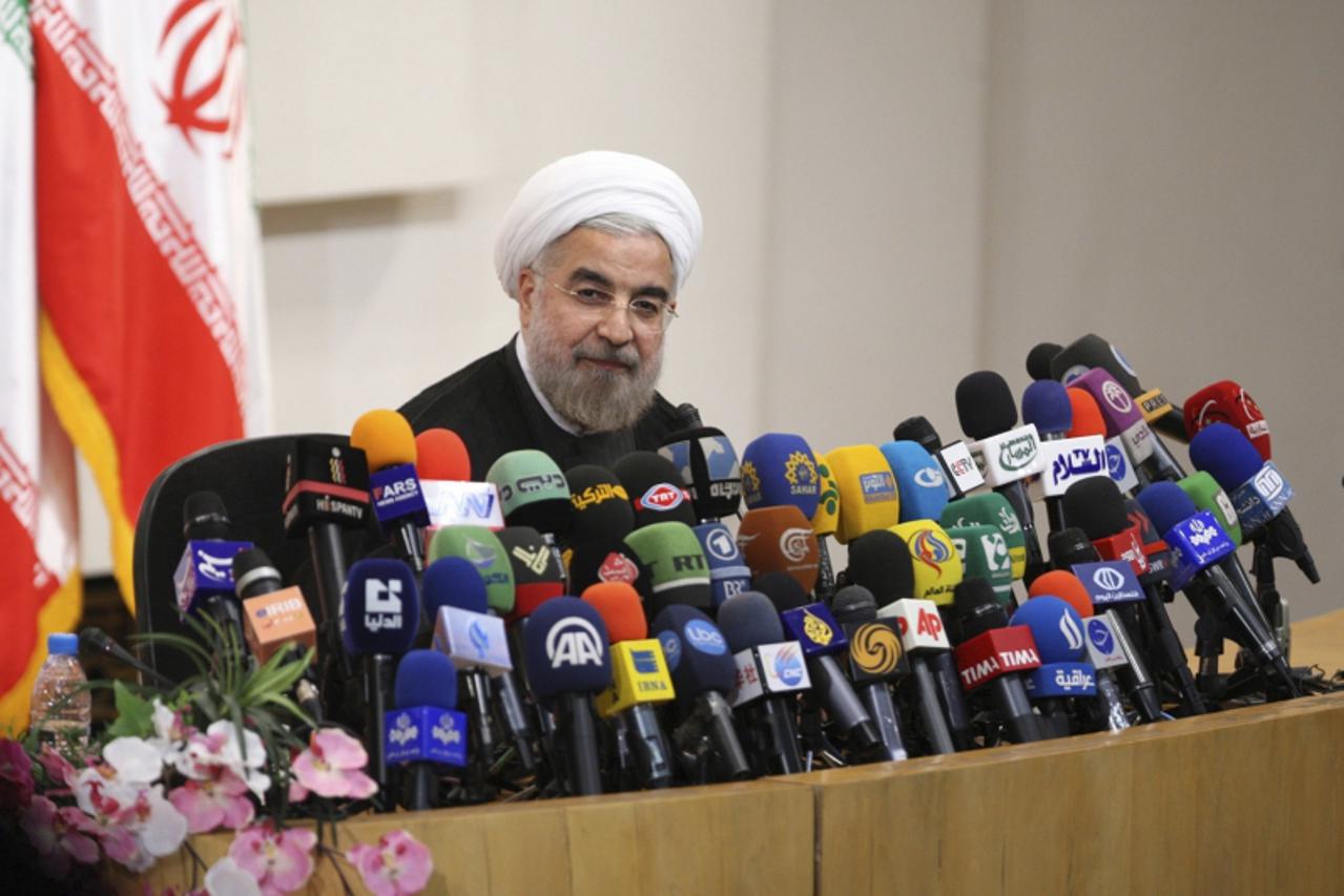 'Iranian President-elect Hassan Rohani speaks with the media during a news conference in Tehran June 17, 2013. REUTERS/Fars News/Majid Hagdost  (IRAN - Tags: POLITICS PROFILE) ATTENTION EDITORS - THIS