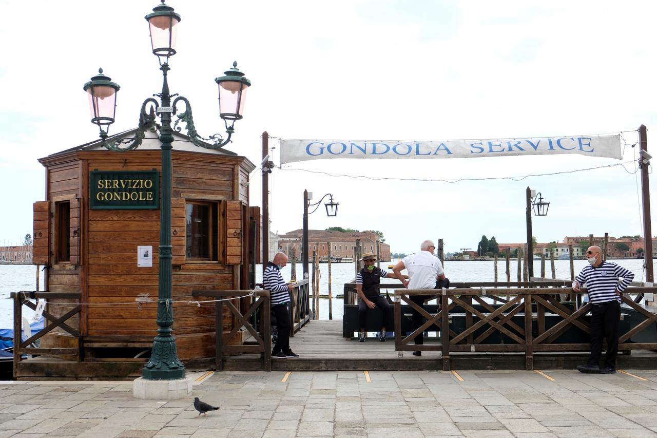 Gondoliers officially resume work for the first time following the country's strict coronavirus disease (COVID-19) lockdown in Venice