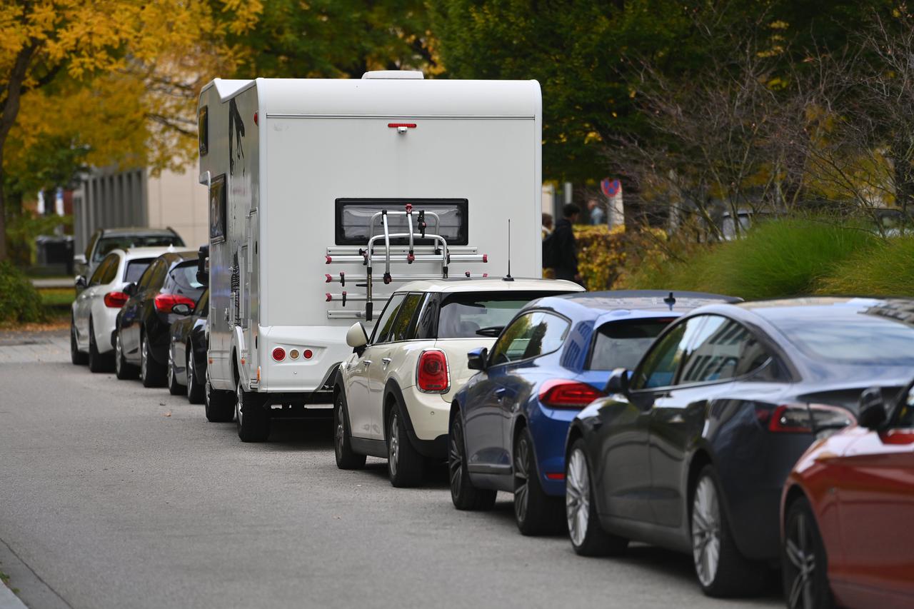 Parking motorhomes in public parking spaces.