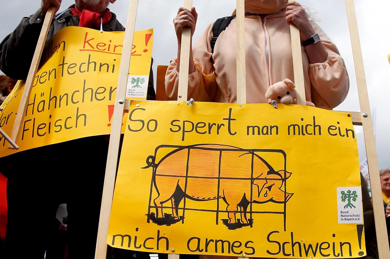 People dressed in costumes take part in a demonstration against the Transatlantic Trade and Investment Partnership (TTIP), a proposed free trade agreement between the European Union and the United States, in Munich April 18, 2015. The posters (L-R) read, 