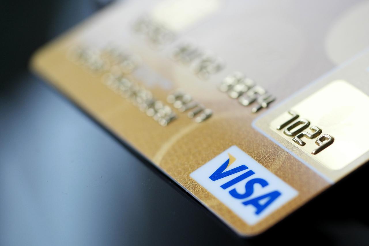 A visa credit card is on display on a table in Berlin The European Union wants to reduce extra fees for payments with credit cards throughout Europe. Photo:?Joerg Carstensen/dpa/DPA/PIXSELL