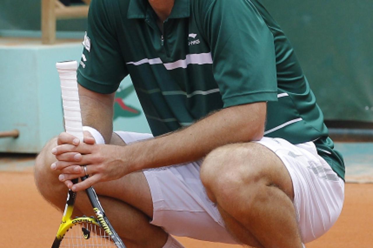 'Croatia\'s Ivan Ljubicic reacts after a point gainst Spain\'s Rafael Nadal to during their Men\'s fourth round match in the French Open tennis championship at the Roland Garros stadium, on May 30, 20