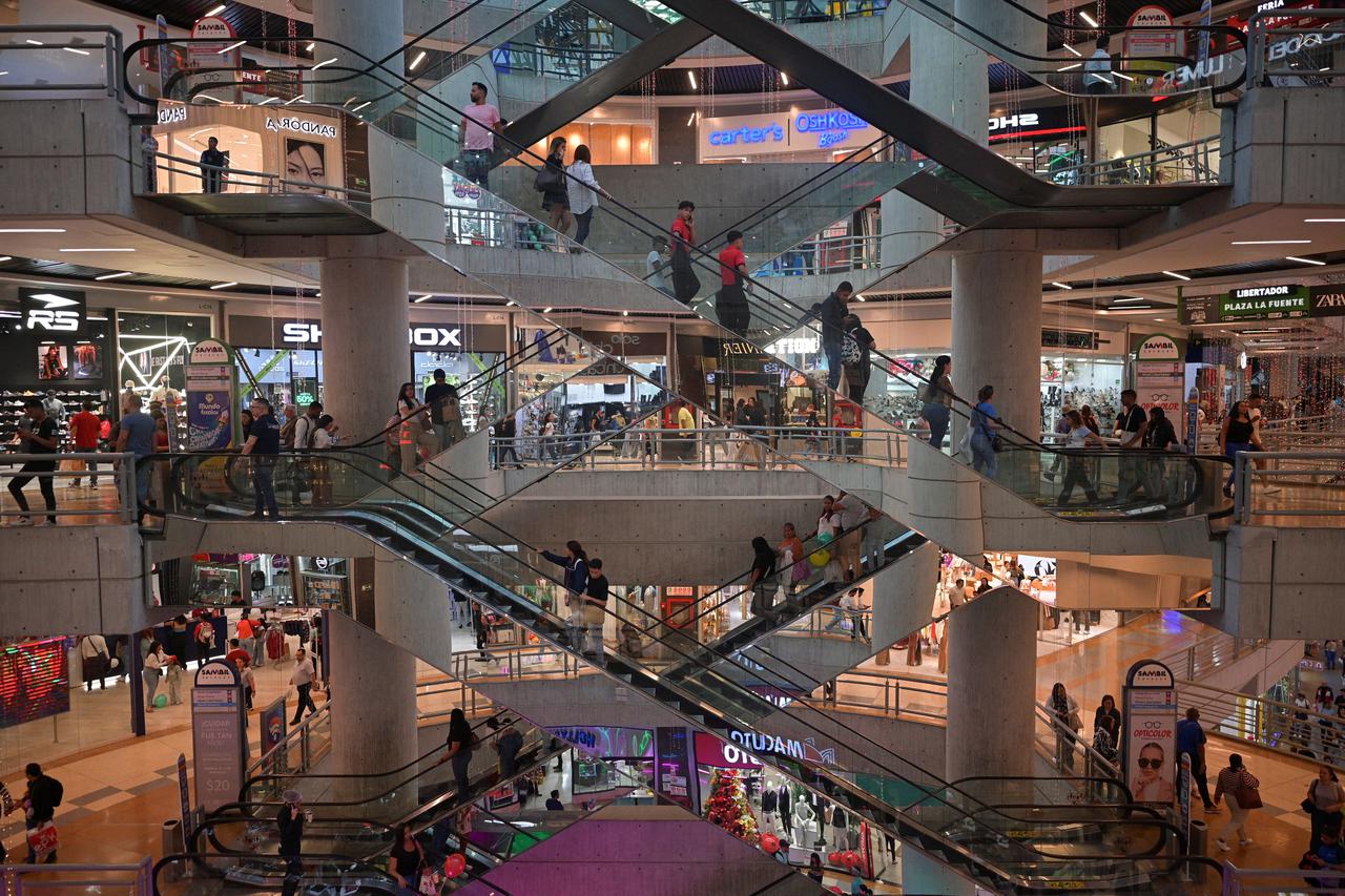 People shop in a mall during a Black Friday sale, in Caracas