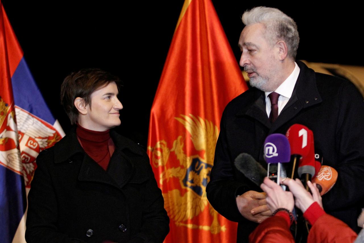 Montenegro's PM Krivokapic (R) welcomes his Serbian counterpart Brnabic to receive a Sputnik V vaccine donation in Podgorica