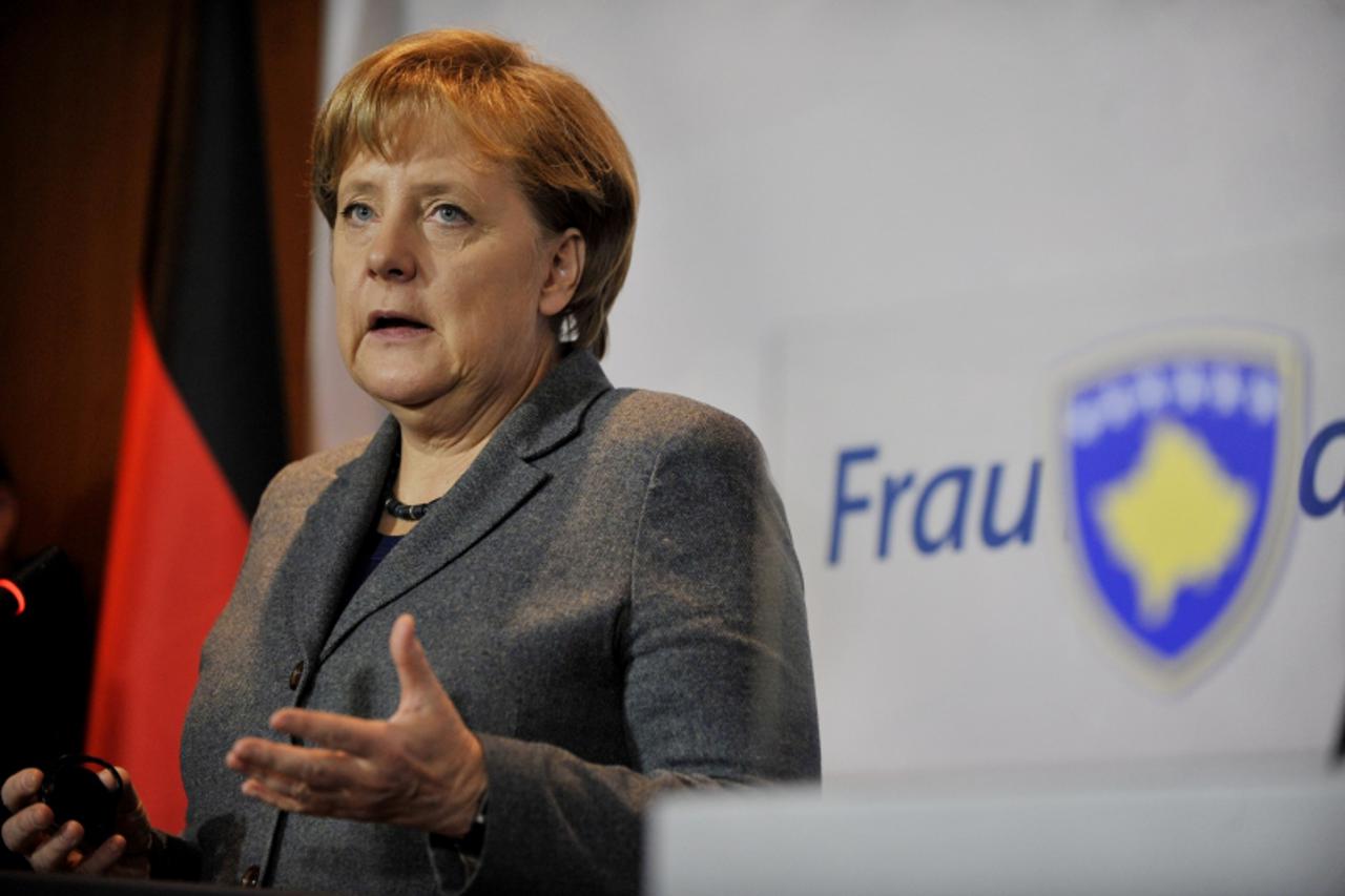 \'German Chancellor Angela Merkel gives a press conference on December 19,2011 with Kosovar prime minister at Pristina International Airport.  Merkel on December 19 called on Pristina and Belgrade to 