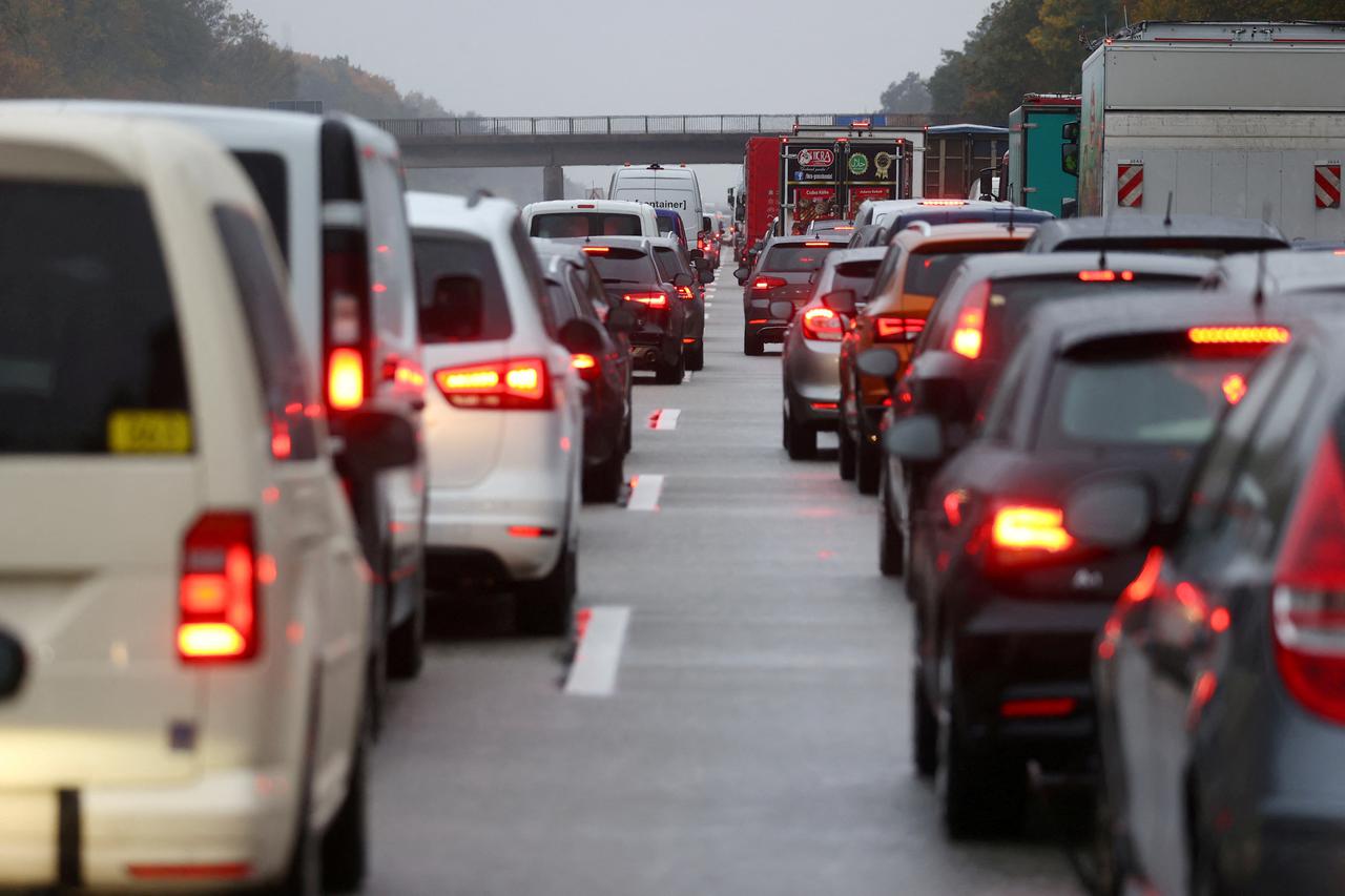 FILE PHOTO: Activists hang on a bridge of A5 highway near Frankfurt causing traffic jams