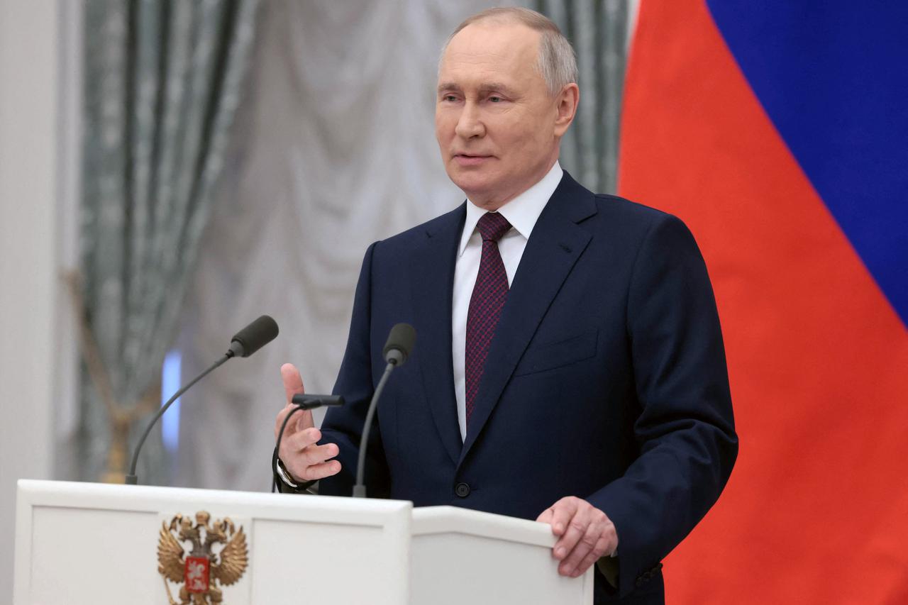 Russian President Putin attends a ceremony marking International Women's Day
