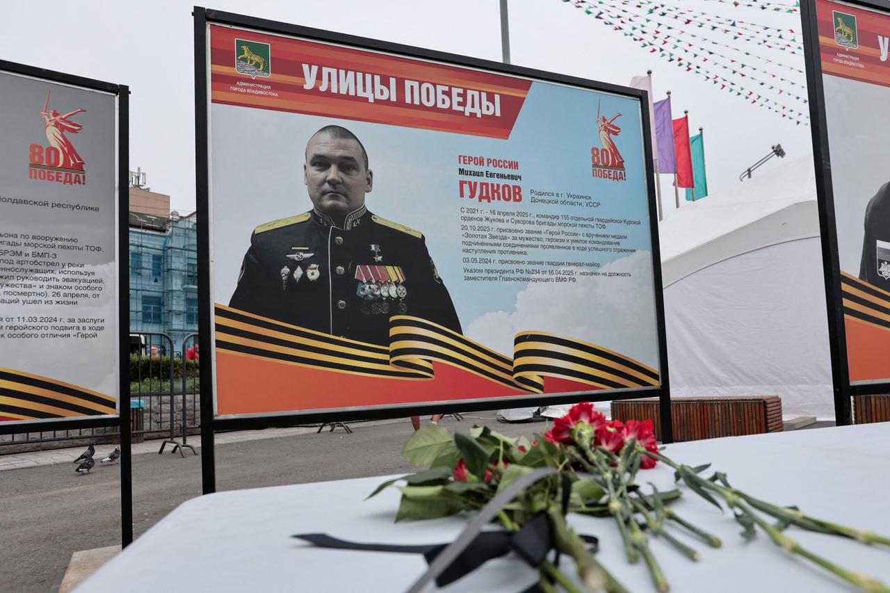 People in Vladivostok lay flowers near portrait of Russian Major General Gudkov reportedly killed amid Russia-Ukraine conflict