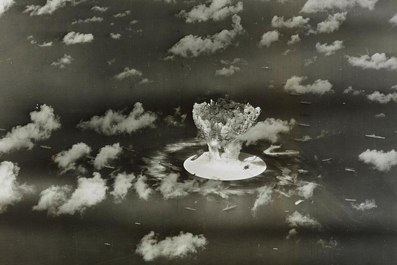 FILE PHOTO: Handout of a mushroom cloud rises with ships below during Operation Crossroads nuclear weapons test on Bikini Atoll