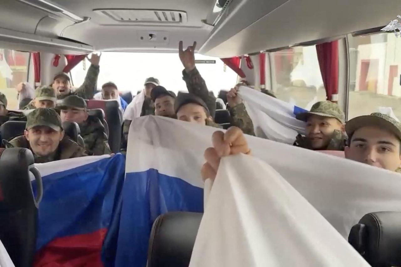 Freed Russian prisoners of war board a bus in Belarus