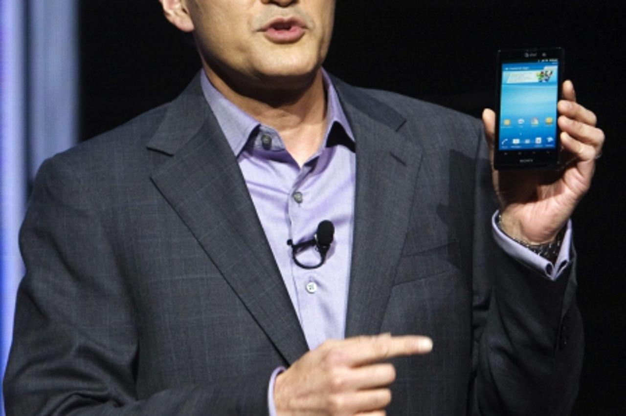 'Kazuo Hirai, executive deputy president of Sony Corp., holds an Xperia smartphone during a Sony news conference at the Las Vegas Convention Center in Las Vegas, Nevada, January 9, 2012.  REUTERS/Stev