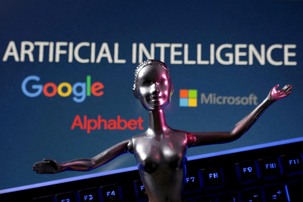 FILE PHOTO: Illustration shows Google, Microsoft and Alphabet logos and AI Artificial Intelligence words